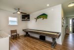 Enjoy shuffle board, arcade games, a drink fridge, and a flat screen TV in the game room